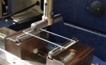 Using Controlled Defects in Glass to Assess Strength